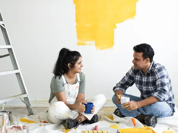 couple-taking-break-from-painting-walls